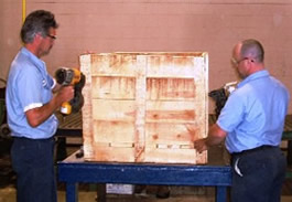 Custom designed wooden shipping crate being constructed